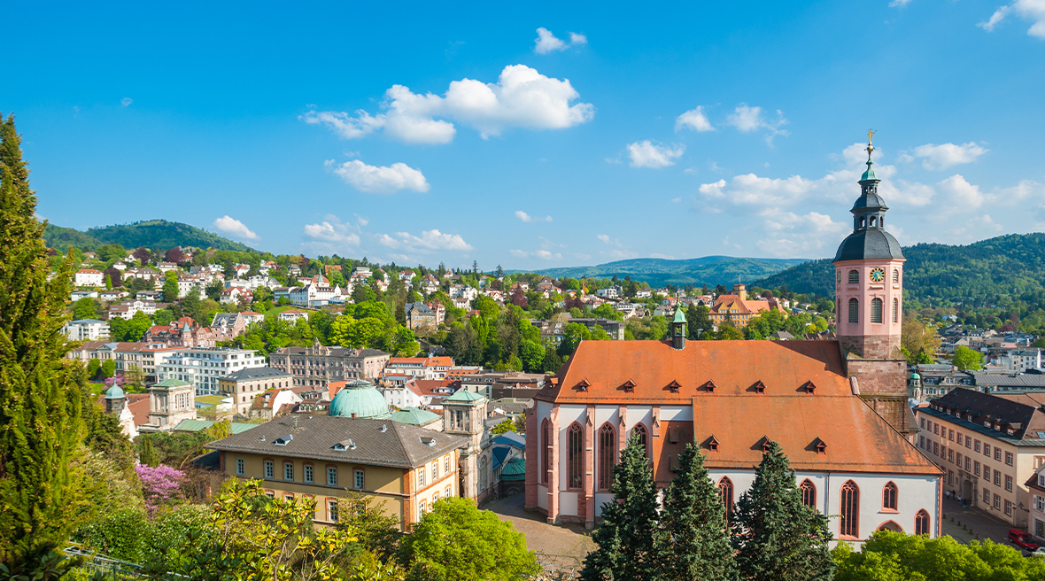 Panoramic view of the Baden-Baden village with historic townhouses and church surrounded by beautiful greenery and landscapes